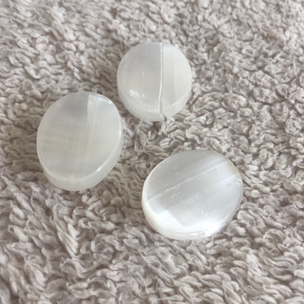 Selenite worry stones. One of the stones is broken